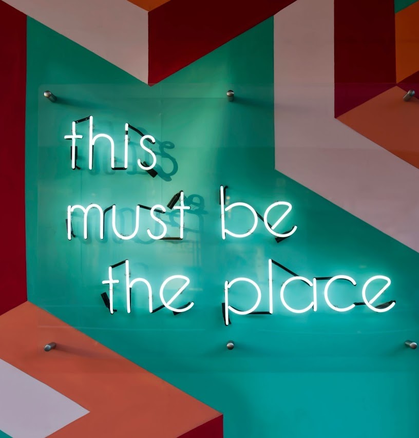 Neon sign reading 'this must be the place'